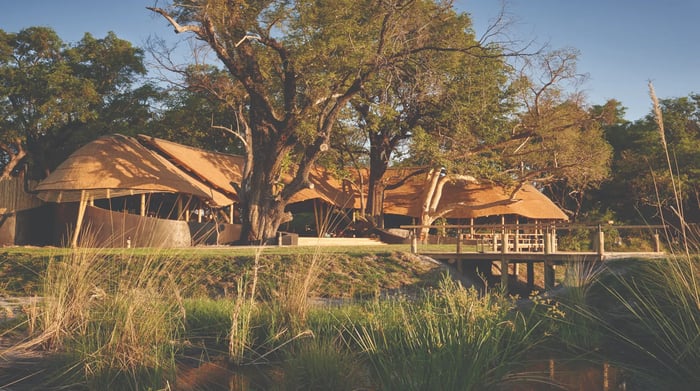 Belmond Eagle Island Lodge grasslands with lodges